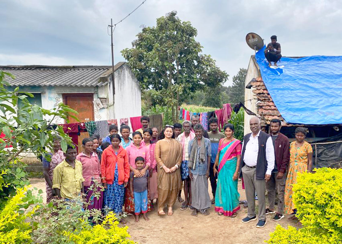 Rotarians Soumya Nair,  A K Sugunan and Roshan Jacob with the villagers. 