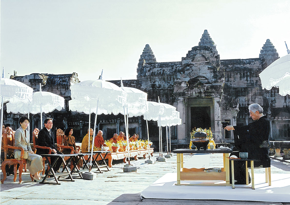 Sen makes a ritual tea offering in prayer for peace at Angkor Wat, Cambodia.