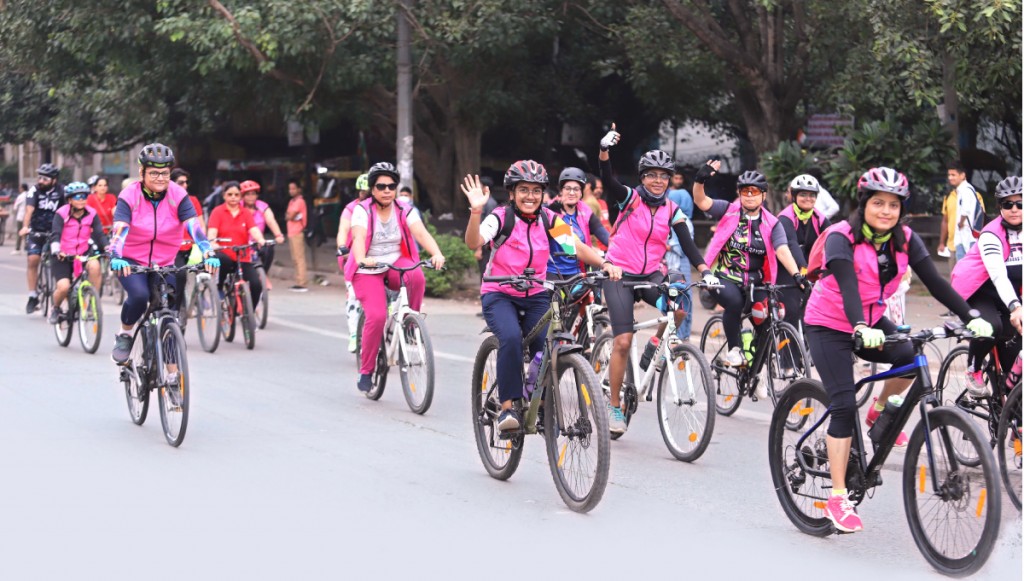 Women participating in the Hope on the Wheels cycle rally to create cancer awareness.