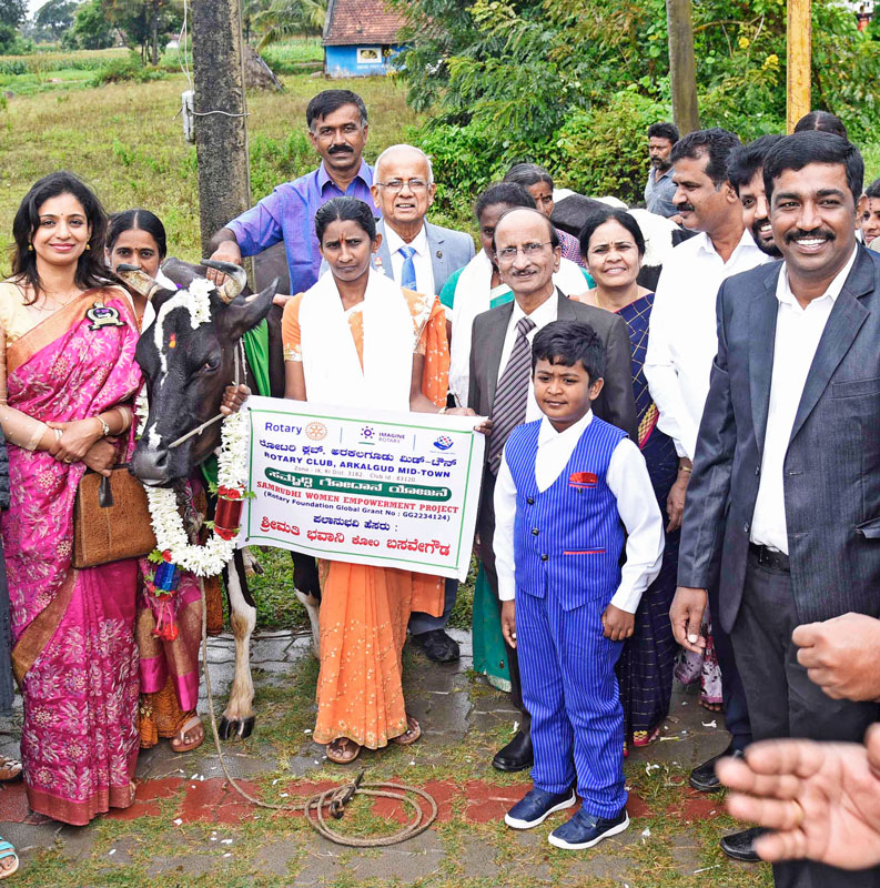 DRFC P Narayana and PDG M G Ramachandramurthy donate a cow to a woman. 