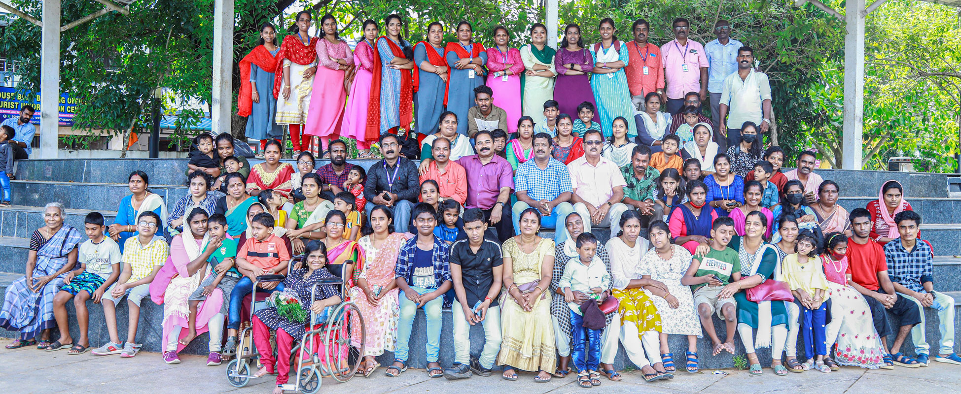 Members of RC Alleppey, along with club president Jose Abraham (seated, centre, second row), with children and their parents.