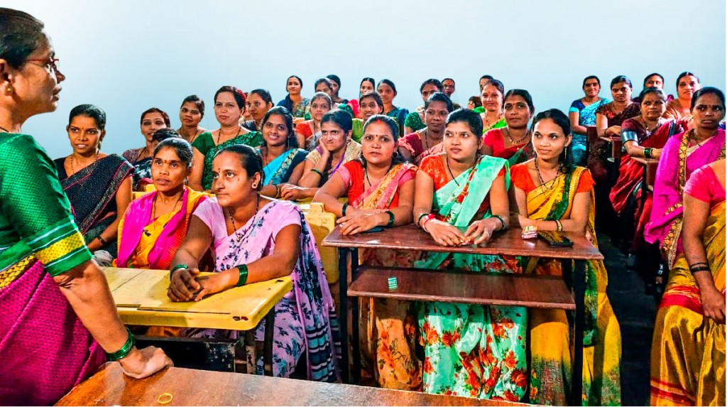 Women from the villages participate in a talk to understand the benefits of iron and folic acid tablets.