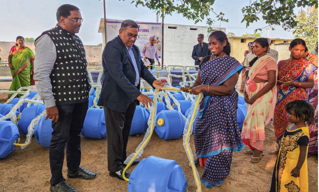 DG Reddy gifts a waterwheel to a villager.