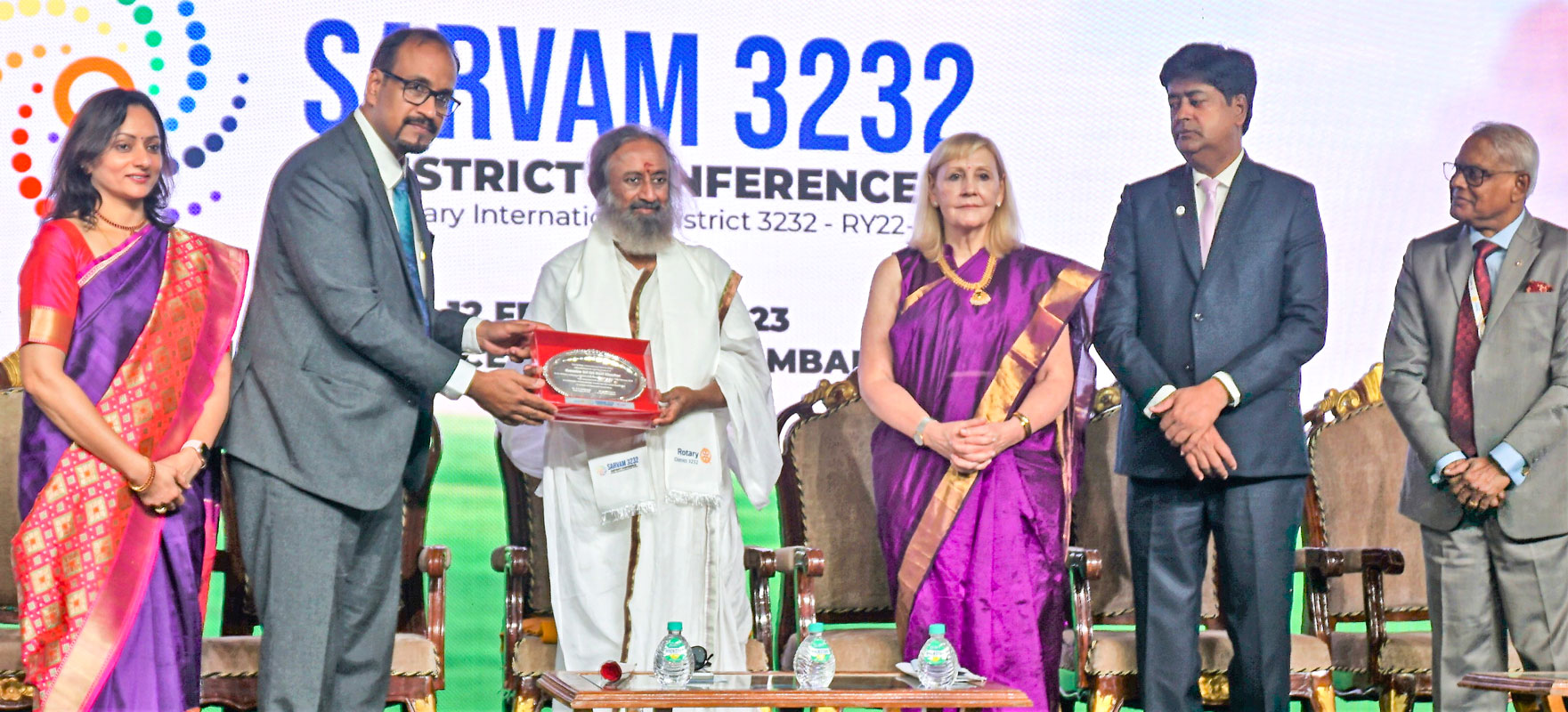 DG N Nandakumar presents a memento to The Art of Living founder Ravi Shankar in the presence of (from L) Sumedha, RIDs Elizabeth Usovicz and A S Venkatesh, and RIDE Anirudha Roychowdhury.