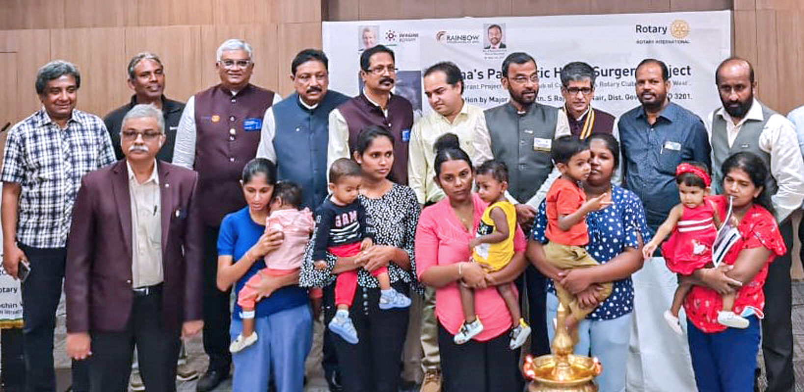 Sri Lankan children with their parents, along with DG Rajmohan Nair and Rotarians of RC Cochin West, at the hospital in Kochi after the CHD surgery. PDG Madhav Chandran is on the right.
