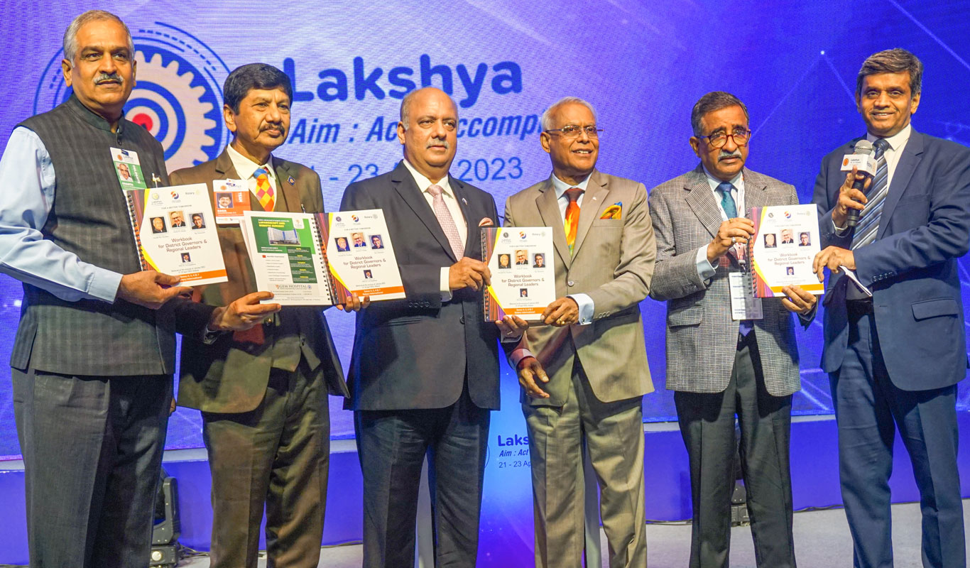 From L: PDG H R Ananth, Lakshya chairman PDG E K Sagadhevan, PRIP Shekhar Mehta, RIDEs Anirudha Roy Chowdhury and T N Subramanian, and PDG Rajendra Rai, after releasing the Workbook for District Governors and Regional Leaders at the Lakshya programme in Kolkata.