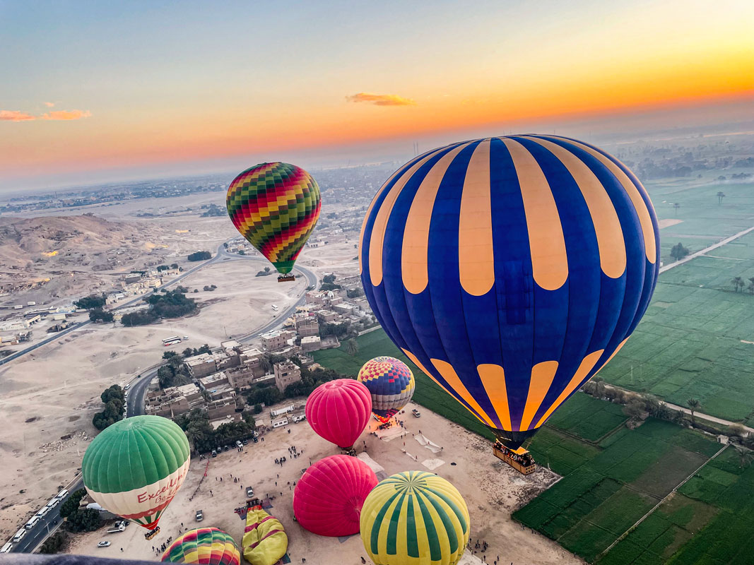 Hot air balloons flying over the Nile valley. 
