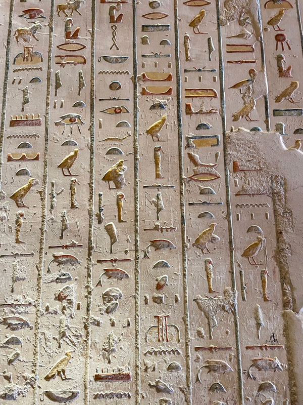 Hieroglyphic text encrypted on a wall in one of the tombs at the Valley of the Kings.