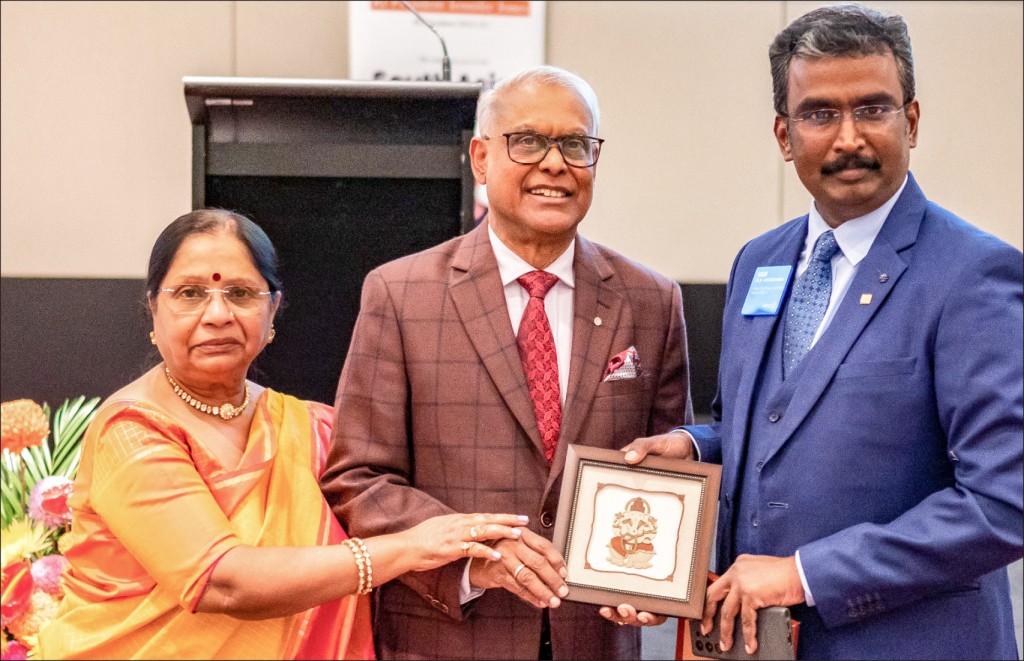 Chairman of South Asia Reception PDG M Muruganandam honours RIDE Anirudha Roychowdhury and Shipra. 
