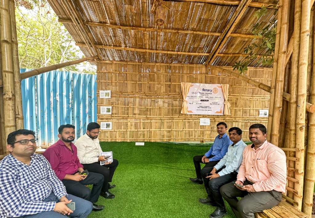 Commuters at the bamboo bus shelter installed by RC Thane Imperial.