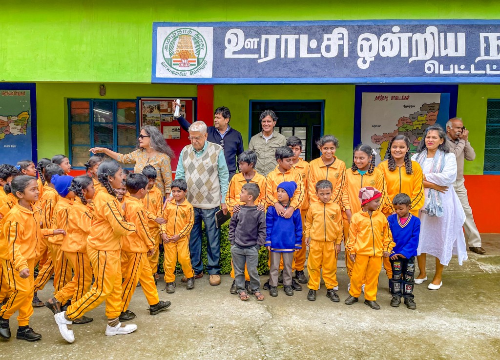 Club members with students. Club president CHN Kumar is seen on the extreme right.