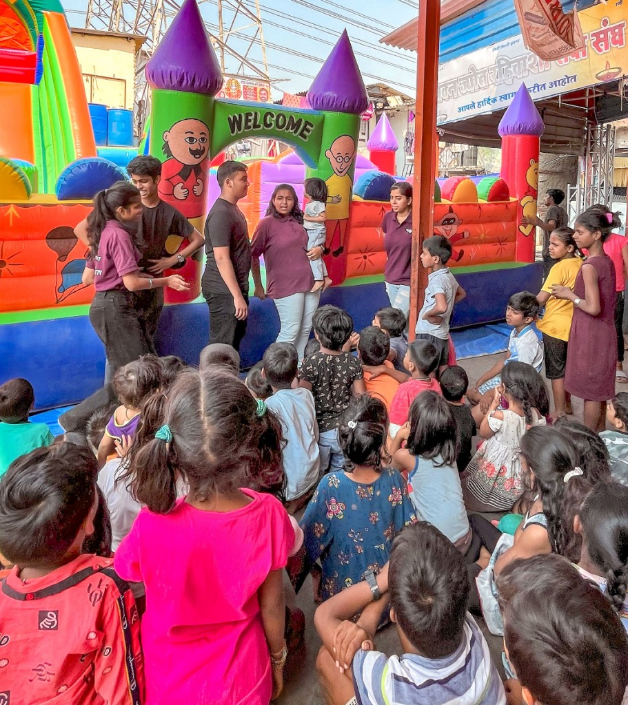 Children enjoying the Masti Mela fun fair organised by RAC Jai Hind College at the Dharavi slum.
