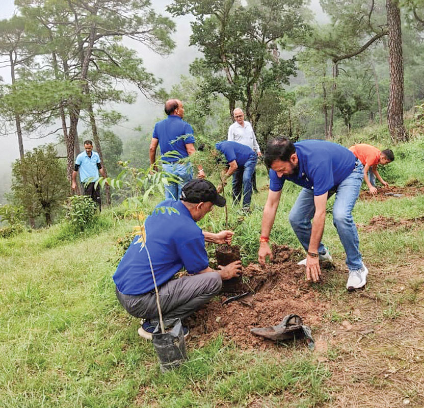 Members of RC Dharamshala plant saplings as part of the Green Himalayan Plantation Drive.