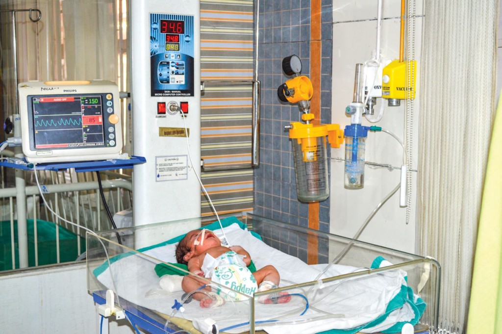 An infant being treated in the neonatal ICU at the hospital.