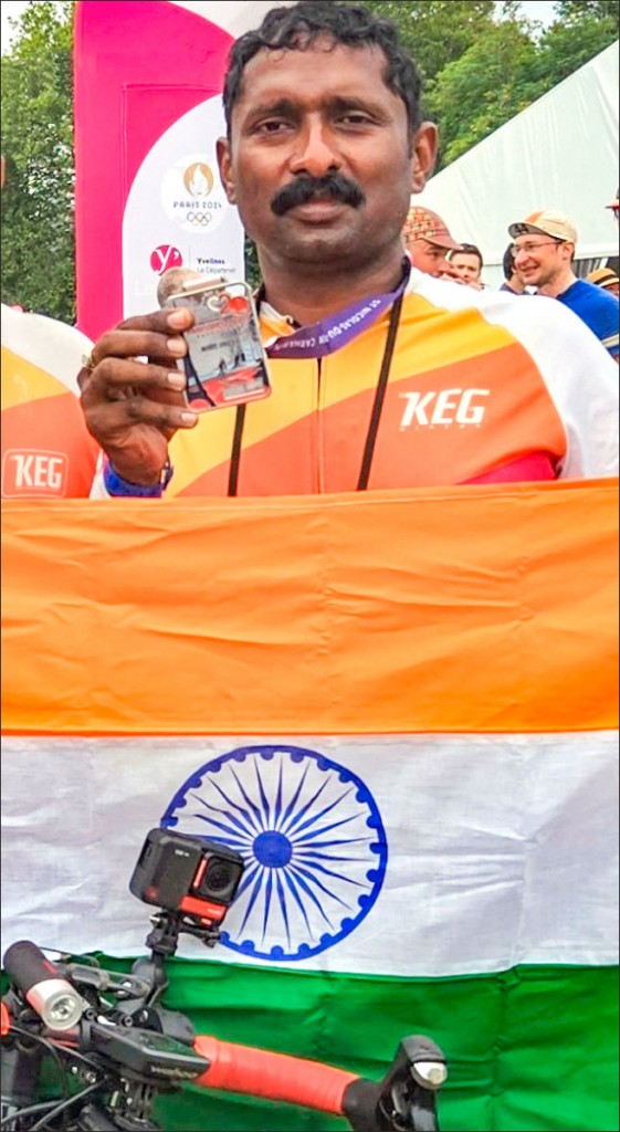 Jittu Sebastian with his medal after completing the race.