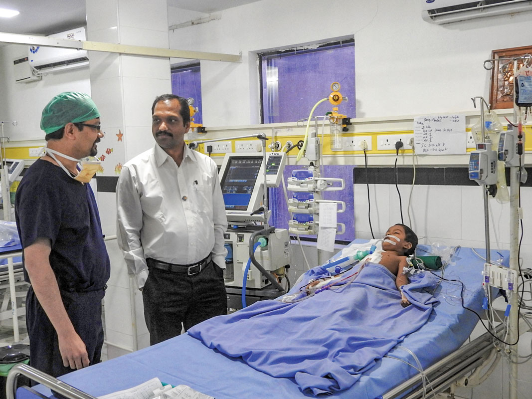 K Saravanan, past president, RC Madras South, with Dr Prashant Shah at the Soorya Hospital where a child is being treated for heart ailment. 