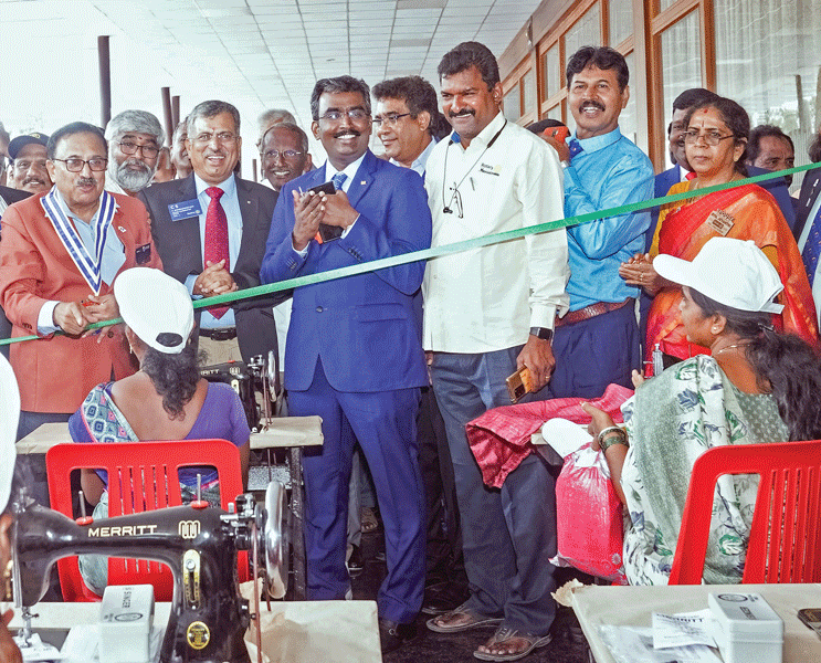 From L: DG S Raghavan, PDGs C Sivagnanaselvam, M Muruganandam and K Sundharalingam at the distribution of sewing machines during the installation in Hosur.