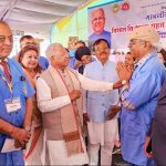 MP Governor Gangu Bhai Patel interacting with RID 3250 PDG Dr R Bharat at the camp. RID 3040 DG Ritu Grover is seen behind the governor.