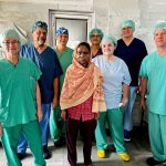 A team of doctors from Interplast-Germany with a burn survivor at one of the corrective surgery camps in Haridwar.