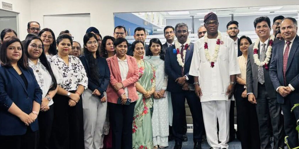 President Babalola, RI VP Muruganandam and RID Nagesh with RISAO Head Rajesh Anand (R) and staff at the RI South Asia Office in Delhi.